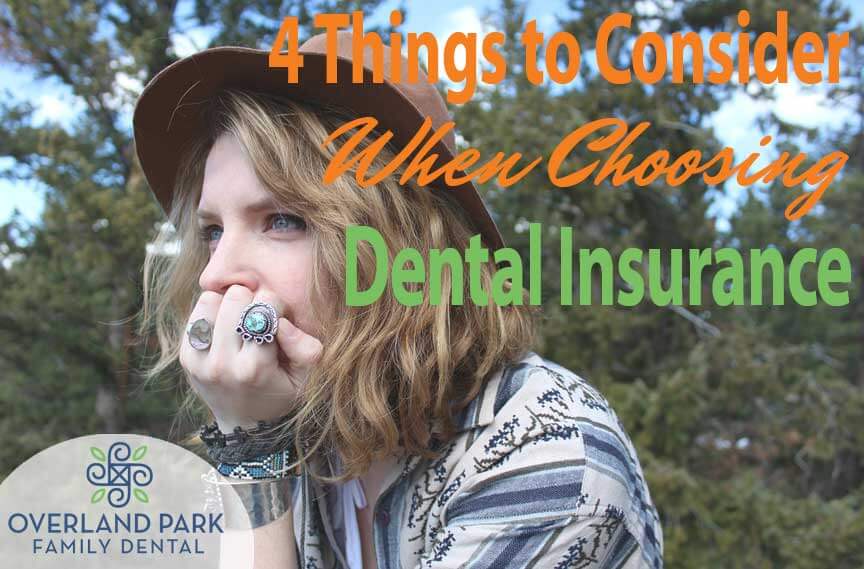 A young woman contemplates choosing her dental insurance.