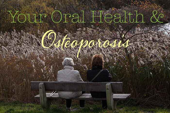 Two woman sitting on a bench contemplating osteoporosis