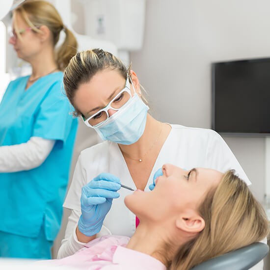 dentist examining a patient's mouth