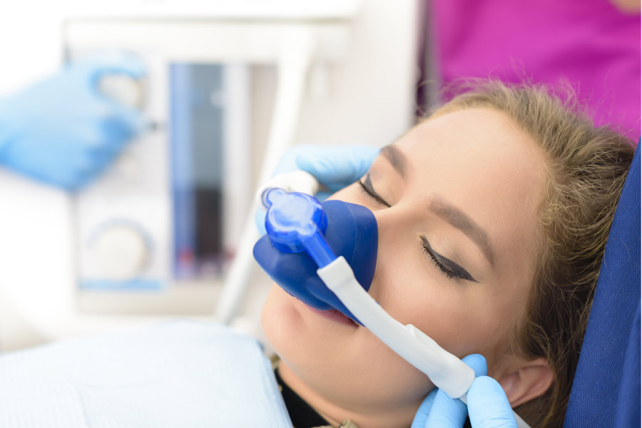 young woman undergoing sedation dentistry at the dentist office